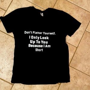 Women’s black T-shirt with white writing.